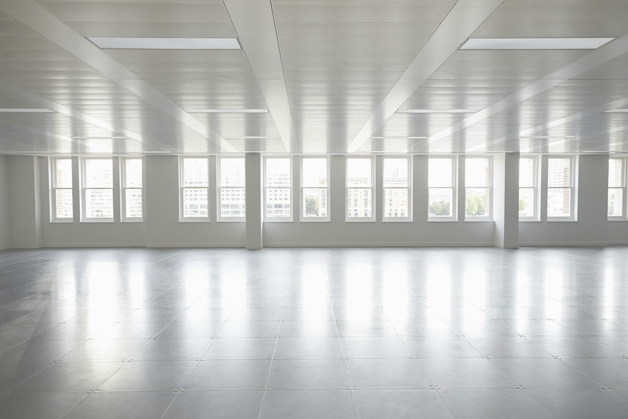 Vacant open plan office space with windows